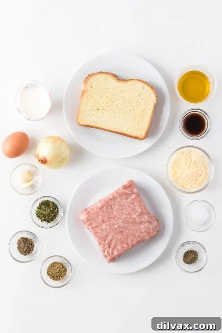 Savory Handcrafted Meatballs 4 Fresh ingredients laid out on a board for making Homemade Meatballs: bread, milk, meatloaf mix, Parmesan, onions, garlic, herbs, and spices.