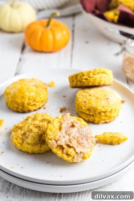 Golden Pumpkin Delights 3 Pumpkin Biscuits with Cinnamon Honey Butter on a plate, ready to be served.
