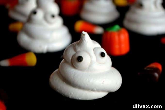 An adorable Halloween treat: dairy-free and gluten-free ghost meringues, perfect for kids.