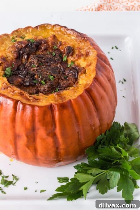 Close-up of a golden brown stuffed pumpkin, showcasing its delicious filling.