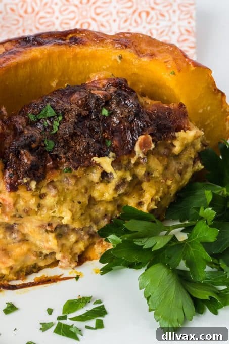 A roasted sugar pie pumpkin, showcasing the golden-brown crust of the savory stuffing.