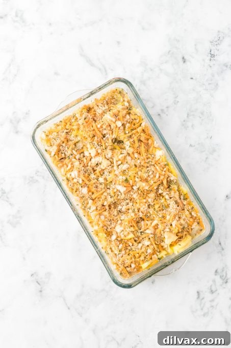 Golden Squash Bake 6 A side dish casserole of yellow squash ready for the oven, topped with a golden, buttery cracker crust.