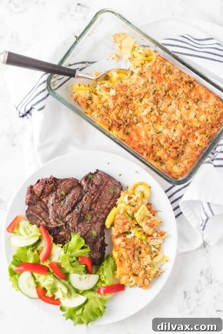 Golden Squash Bake 7 A side dish of yellow squash casserole served in a white bowl.