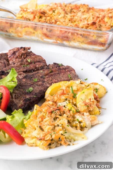 Golden Squash Bake 10 Yellow Squash Casserole in a serving dish, ready for the dining table.