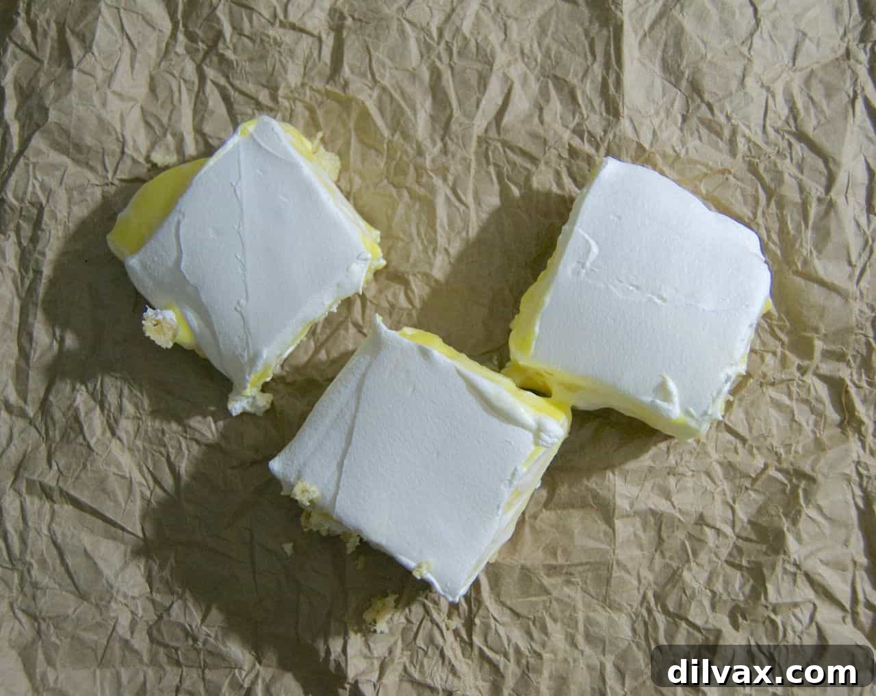 Zesty Lemon Bar Perfection 3 Layers of creamy, dreamy lemon squares with a golden, nutty crust. The perfect balance of sweet and tart.