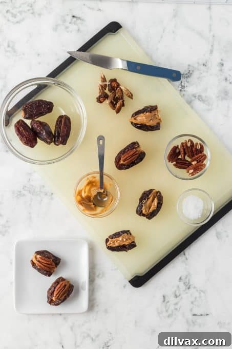 Filling Medjool dates with creamy peanut butter.