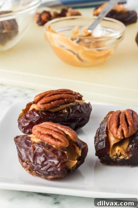 Close-up of Peanut Butter Dates with pecans and sea salt.