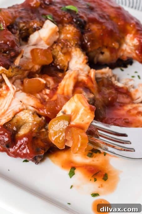 Smoky BBQ Chicken 3 A bite of BBQ grilled chicken.