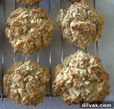 Day 241 - Delicious Peanut Butter Banana Muffins 5 Baked peanut butter banana muffins cooling on a rack, showcasing their golden tops
