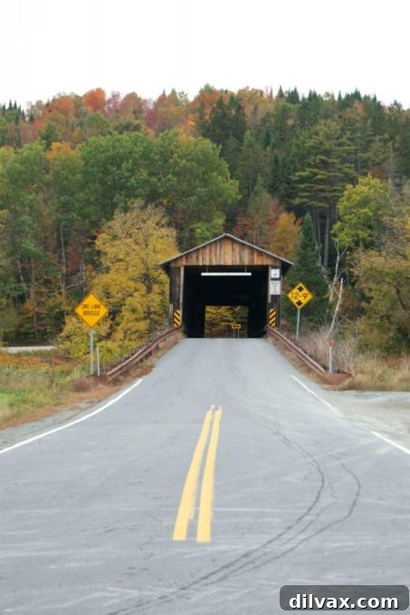 Mt. Orne Covered Bridge #30 in Lancaster, NH, framed by vibrant fall colors