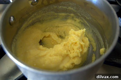 Cheese Cornmeal Biscuits 2 Hot milk and cornmeal mixture resting in a bowl