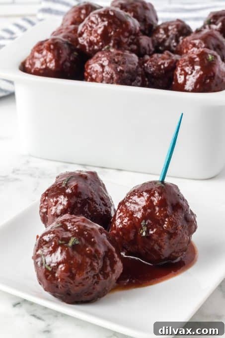 Easy 3-Ingredient Grape Jelly Meatballs 7 Meatballs marinated in grape jelly and chili sauce.