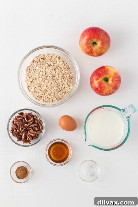 Ingredients for Baked Apple Oatmeal laid out on a table.