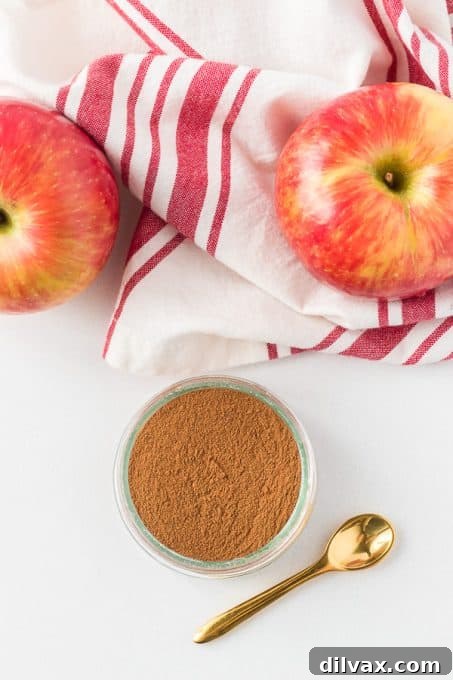 Autumn Spice Blend 6 A small glass jar filled with freshly made Apple Pie Spice, labeled for storage.
