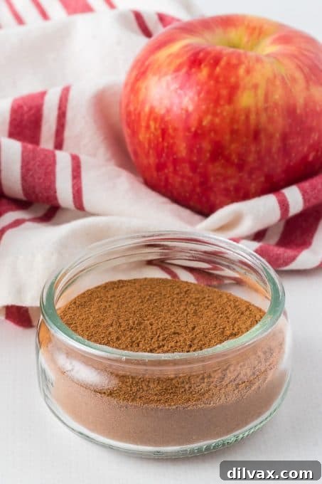 Autumn Spice Blend 7 A collection of apple-themed baking ingredients next to a jar of homemade Apple Pie Spice.