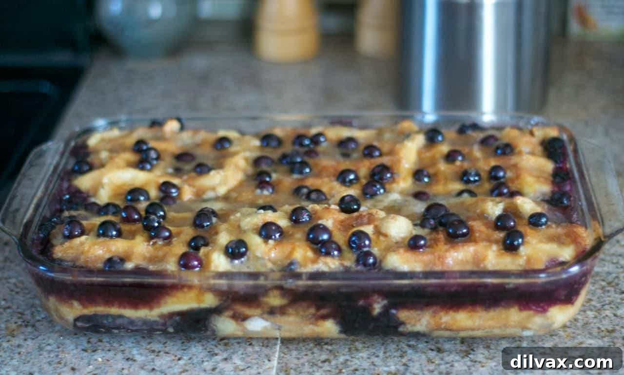 Overhead shot of a square baking dish filled with Baked Blueberry Waffles before serving