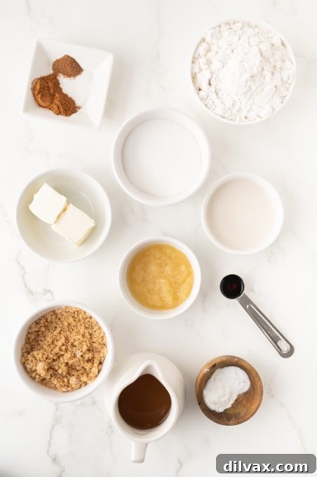 Golden Apple Cider Delights 4 Ingredients laid out for baking Apple Cider Donuts.