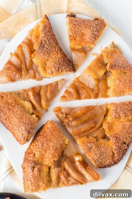 Rustic Cinnamon Pear Tart 10 Sliced pears coated in cinnamon sugar, arranged on a cornmeal galette crust before folding.