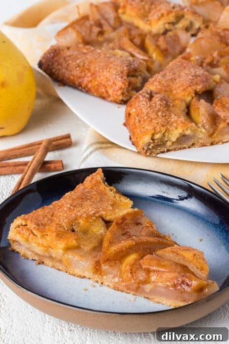 Rustic Cinnamon Pear Tart 8 A perfectly baked slice of Cinnamon Pear Galette, showing the flaky crust and tender filling.