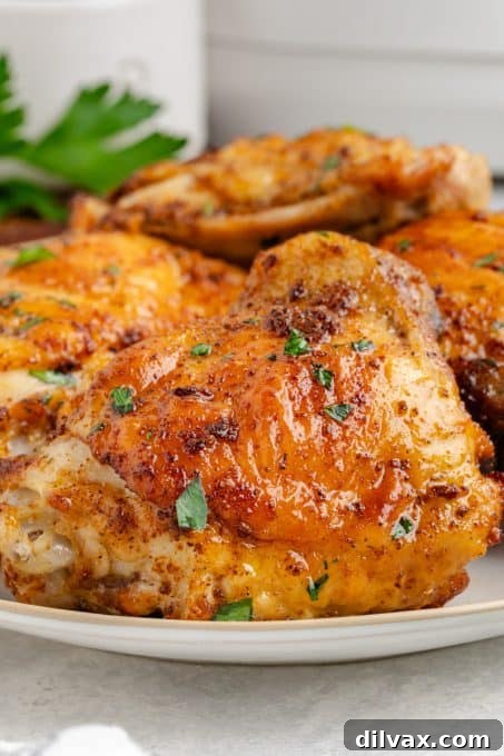 Crispy Air Fryer Chicken Thighs 14 Air Fryer Chicken Thighs arranged beautifully on a serving board.