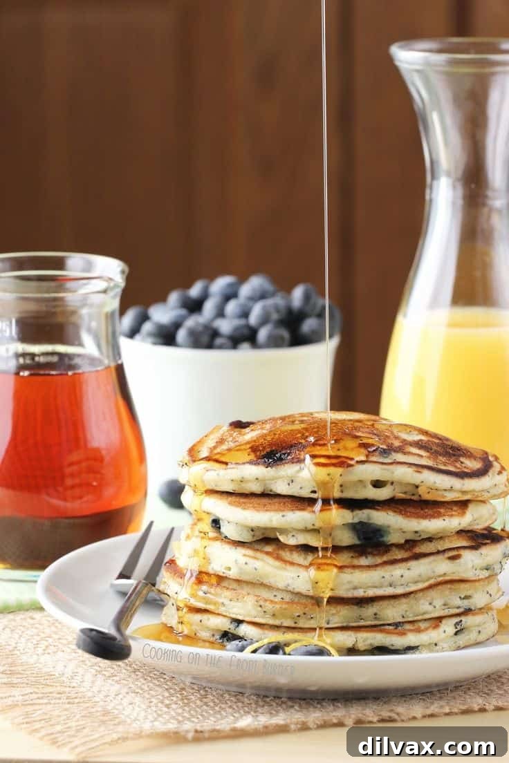 Fluffy Lemon Blueberry Poppy Seed Pancakes with fresh berries