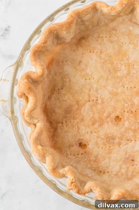 A blind-baked pie crust, golden brown and perfectly ready for filling.