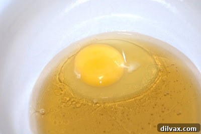 Freshly baked gluten-free dairy-free almond apple muffins in a tin.