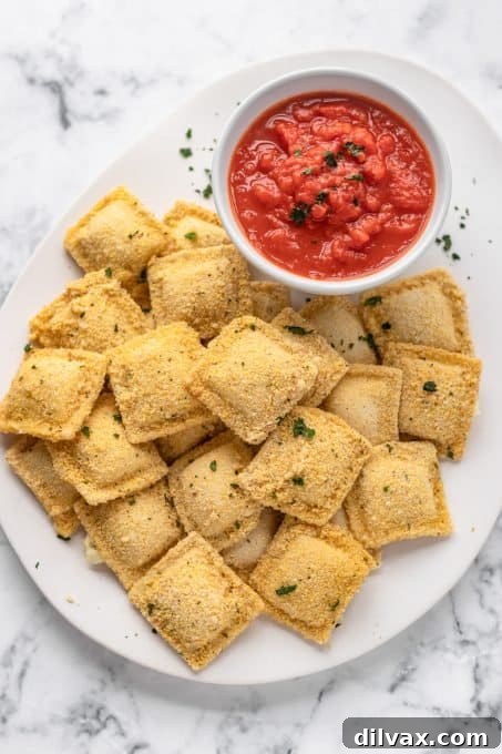 Ravioli as an appetizer coated in bread crumbs and baked in the oven.