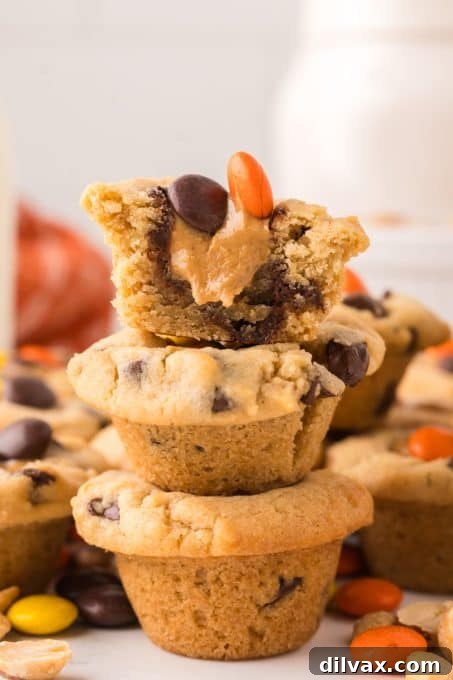 A stunning close-up of a Reese's Cookie Cup, highlighting the texture of the cookie, the creamy peanut butter, and the vibrant Reese's Pieces.