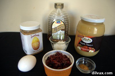 Ingredients for Almond Butter Cranberry Cookies neatly arranged on a counter.