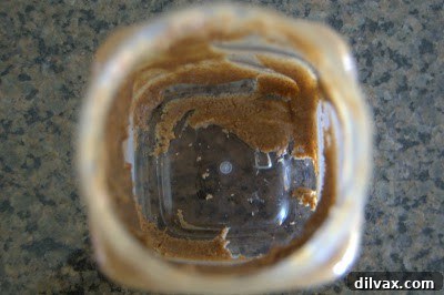 Unbaked cookie dough mixed with cranberries and coconut.