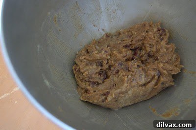 Cookie batter being mixed in a bowl.