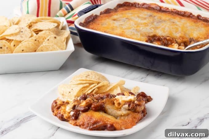 Easy Three Ingredient Chili Cheese Delight 2 The Ultimate 3-Ingredient Chili Cheese Dip, perfect for parties and game day.