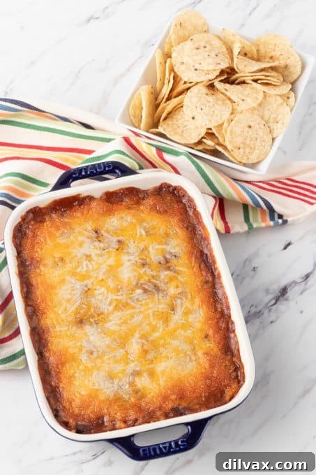 Easy Three Ingredient Chili Cheese Delight 6 A cheesy appetizer dip with chili, perfect for sharing.