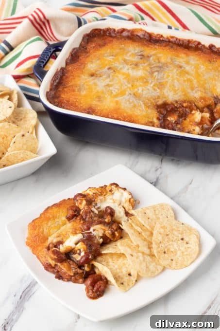 Easy Three Ingredient Chili Cheese Delight 10 A chili dip with two kinds of cheeses, showcasing its rich texture.