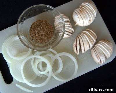 Fresh bone-in pork chops ready for seasoning.
