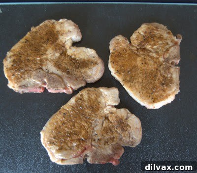 Pork chops thoroughly rubbed with a homemade spice blend.