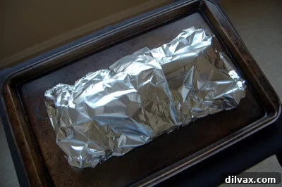 Foil Packet Encasing Pork Chops and Vegetables