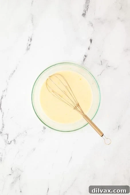 The perfect Orange Glaze, ready for drizzling over bread pudding.