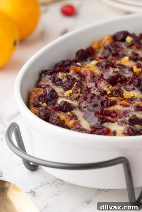 Easy and delicious Cranberry Orange Bread Pudding with a smooth orange glaze.