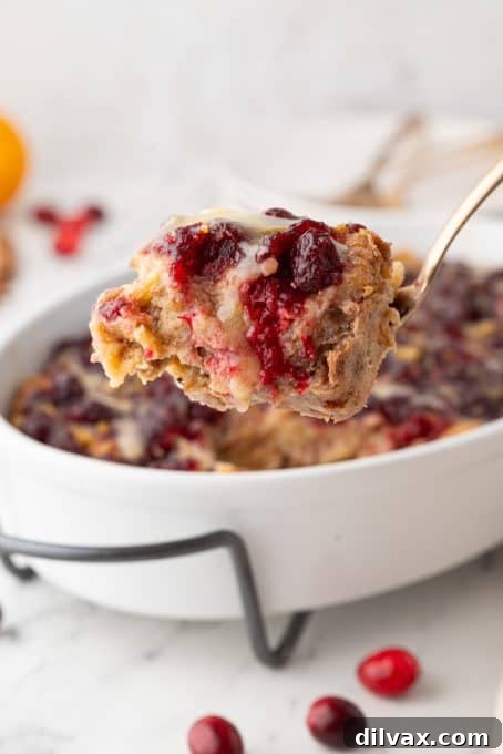 Overhead shot of Orange Cranberry Bread Pudding in a baking dish, ready for serving.