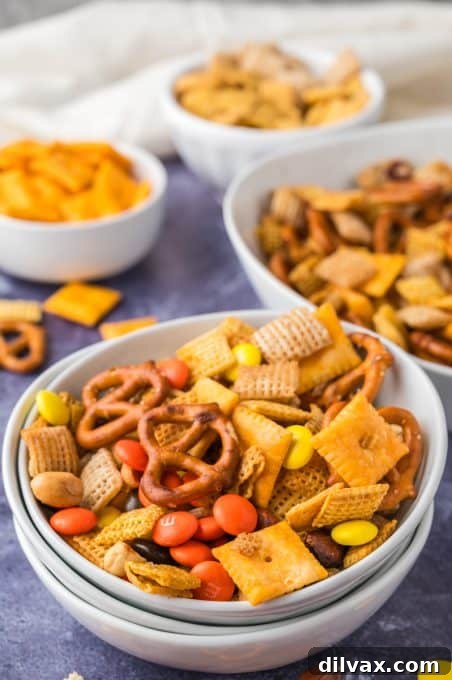 A bowl filled with Homemade Chex Mix, ready to be served at a gathering.