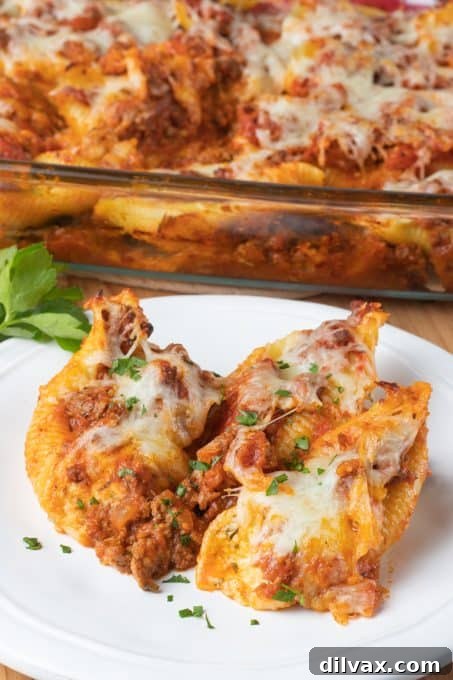 Hearty Baked Stuffed Shells 3 Close-up of baked stuffed shells with sauce and cheese