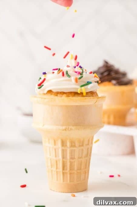 Sweet Cone Cupcakes 8 Putting sprinkles on a wafer cone cupcake.