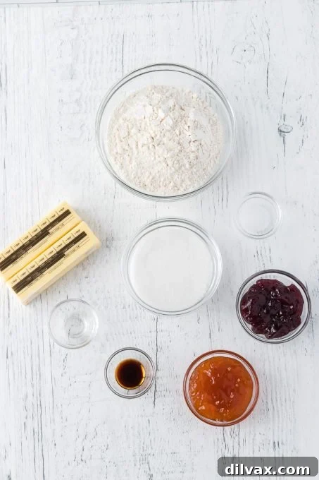 Jewel Box Cookies 4 Ingredients for making classic Thumbprint Cookies laid out on a surface.