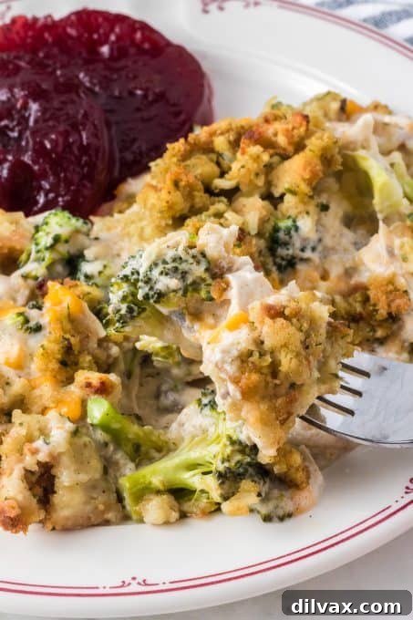 A bite of broccoli, stuffing and chicken.