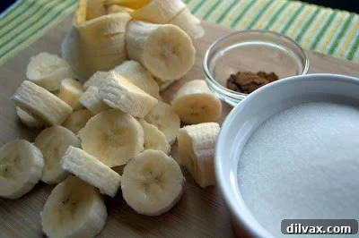 Freshly baked Banana Monkey Muffins cooling on a wire rack, ready to be frosted.