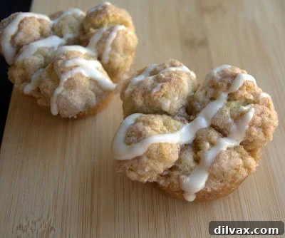 Close-up of a frosted Banana Monkey Muffin on a cooling rack, showing its intricate texture.