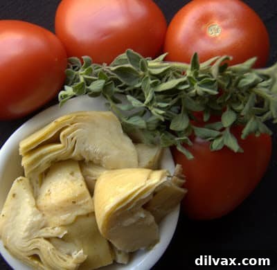 Artichoke Tomato Chicken ingredients ready for baking, emphasizing ease and freshness