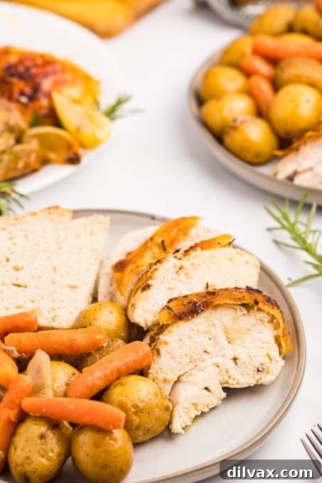 Chicken breast from a whole chicken cooked in a Dutch oven.